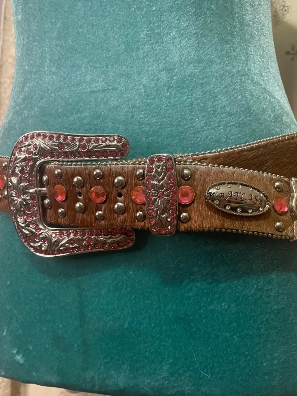 WB Atlas: Western-style belt featuring brown hair-on leather and pink crystals